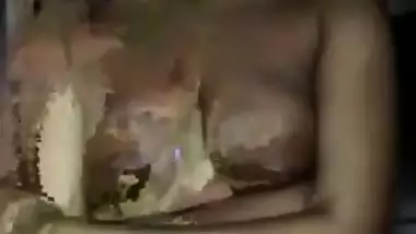 Indian slut tries not to look into camera while posing with naked tits