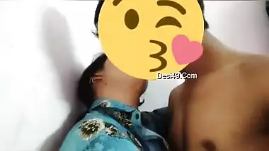 Desi girl in floral shirt kisses porn partner being covered with a smile