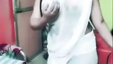 Desi girl in transparent sari dances and sings in short TikTok video