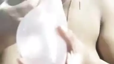 XXX video of the playful Indian aunty trying to blow up a condom