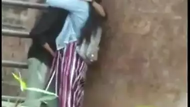 Outdoor Desi mms clip of Indian lovers caught making out by the wall