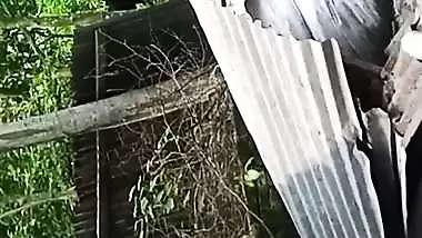 Village neighbor girl outdoor bath caught through hole
