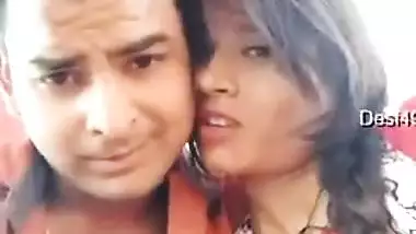 Handsome young man paws Indian's perfect boobs through red dress